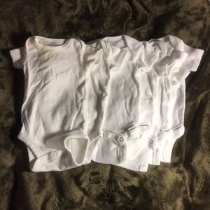 Gerber 7 white onesies.  Size NEWBORN.